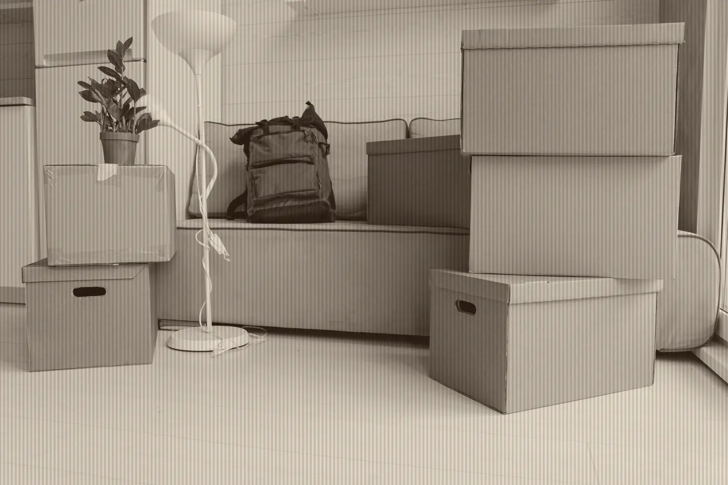 A stack of corrugated moving boxes loaded to a plan